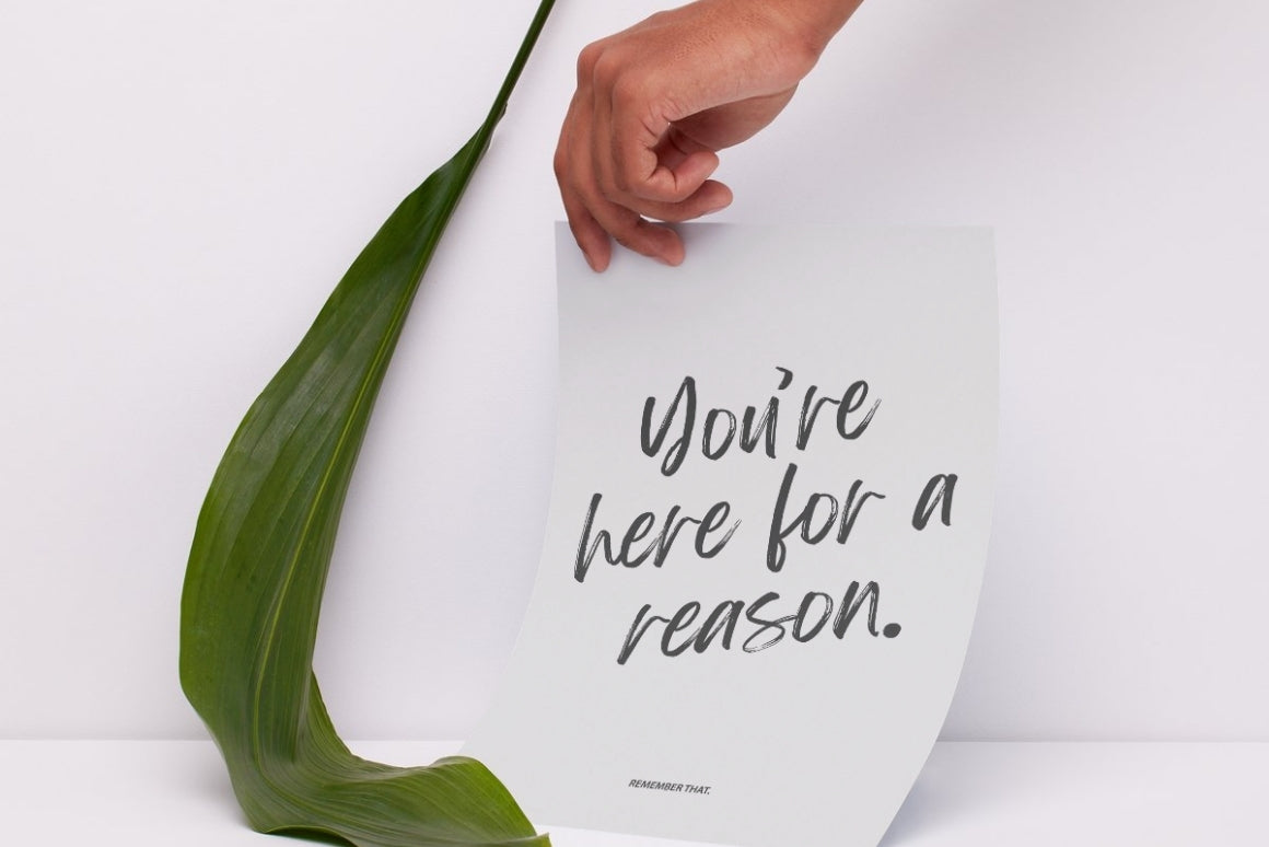 Black and white inspirational wall art with bold handwritten text